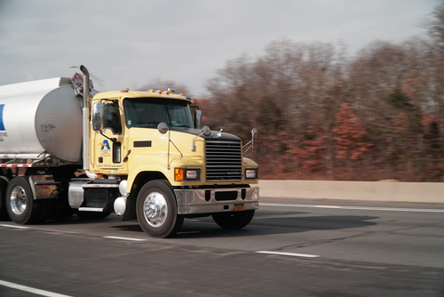 yellow truck on the road